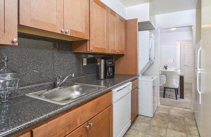 stackable washer and dryer in at the end of kitchen 