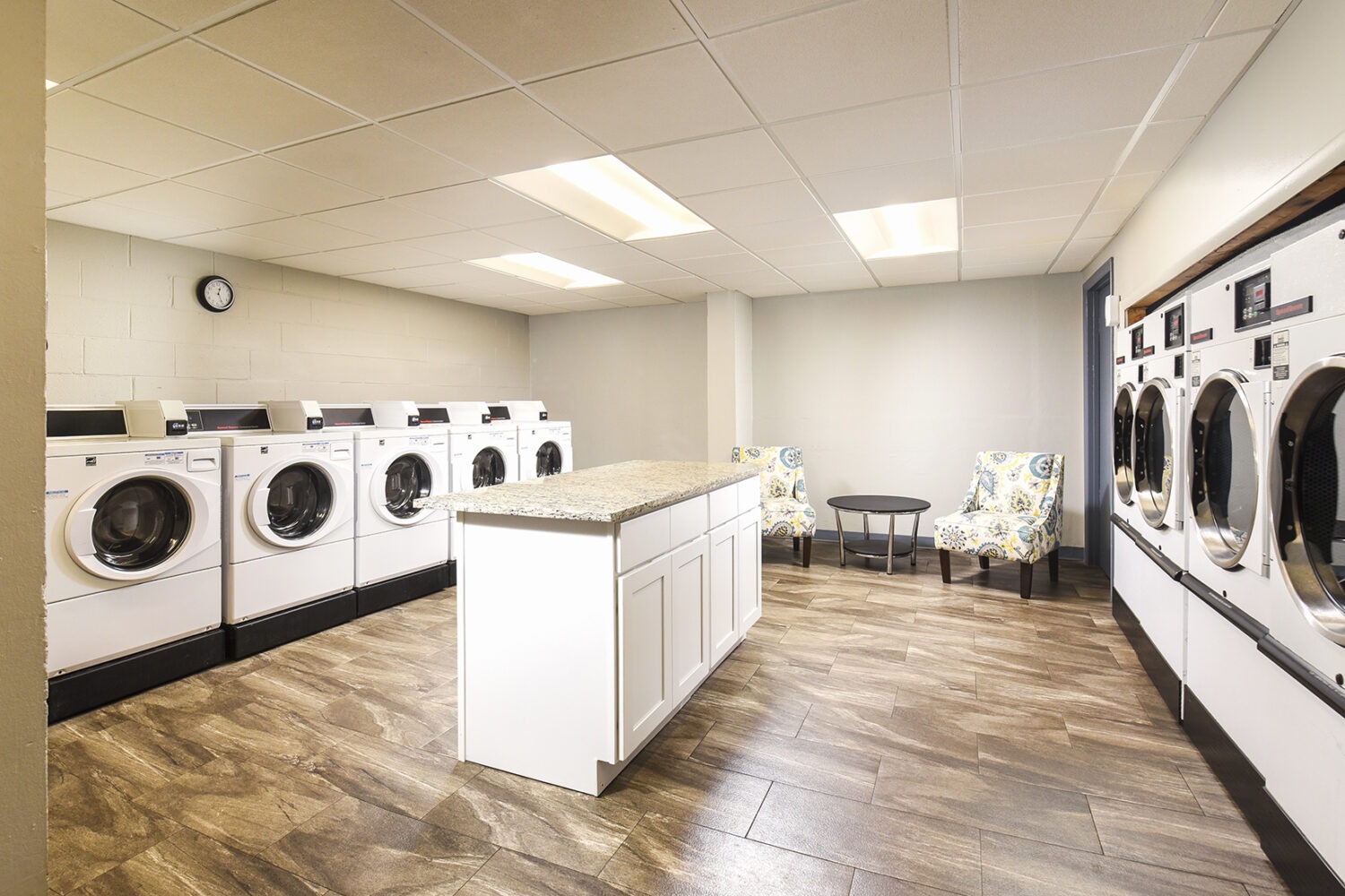large washer and dryers in laundry room 