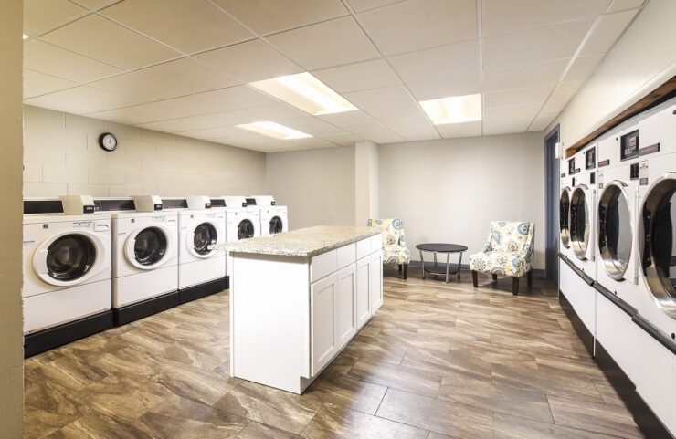 large washer and dryers in laundry room 