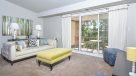 large living room with carpet and sliding door to patio
