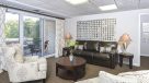 seating area with sofa and two chairs in the leasing office 