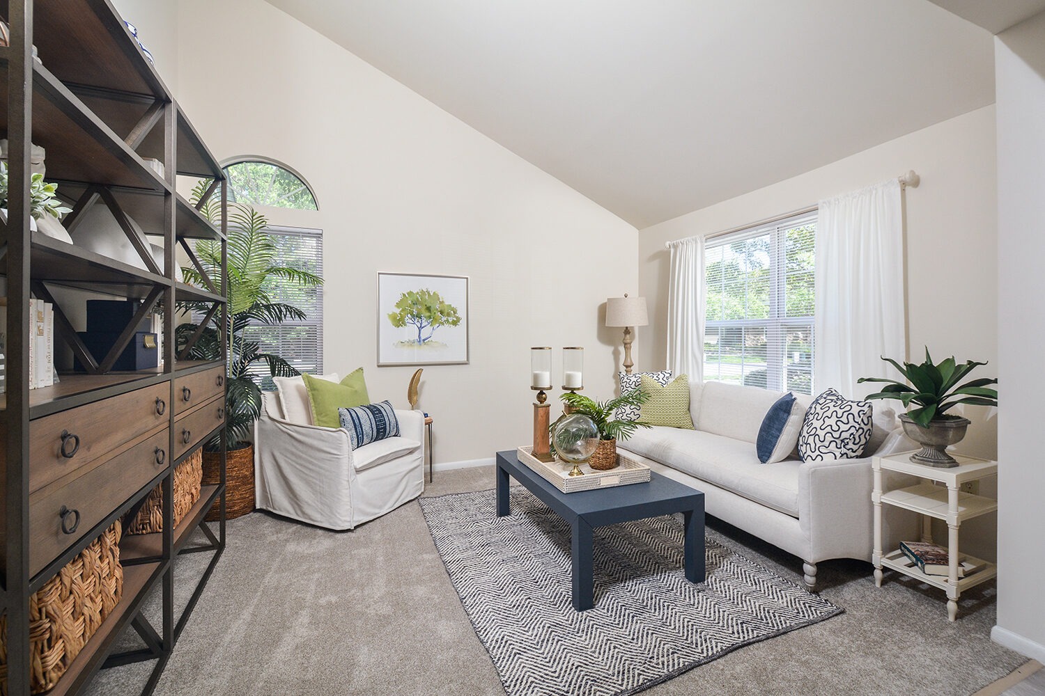large living room with high ceilings and large windows