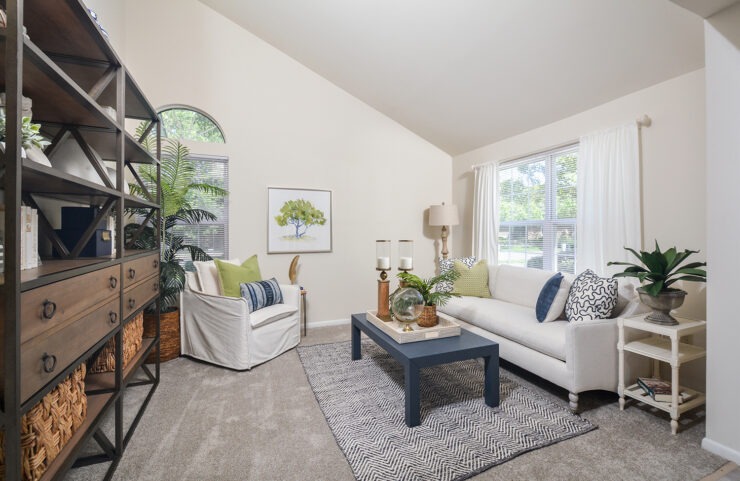 large living room with high ceilings and large windows