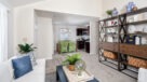 living room in deluxe holly model with wall to wall neutral carpet 
