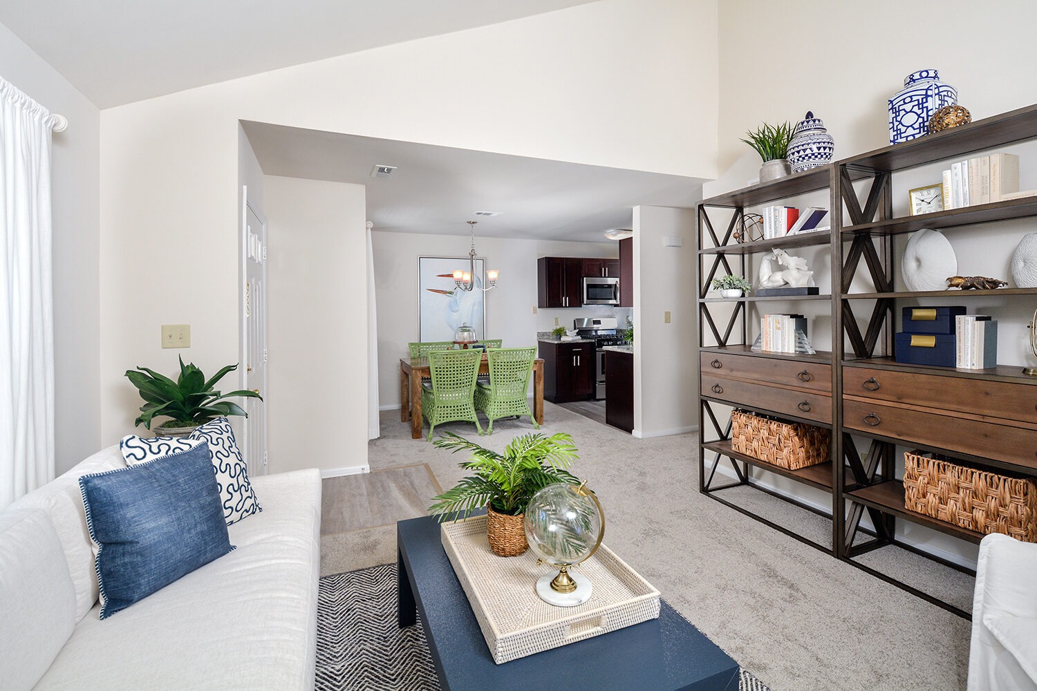 living room in deluxe holly model with wall to wall neutral carpet