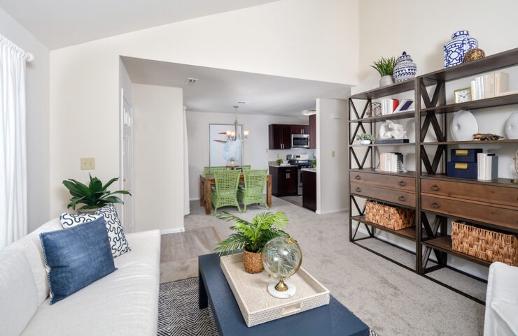 living room in deluxe holly model with wall to wall neutral carpet 