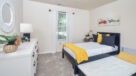 second bedroom with wall to wall carpet 
