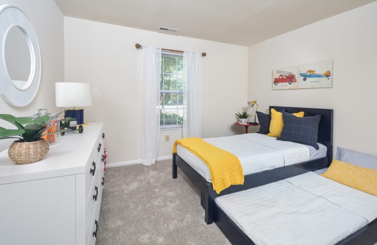 second bedroom with wall to wall carpet 