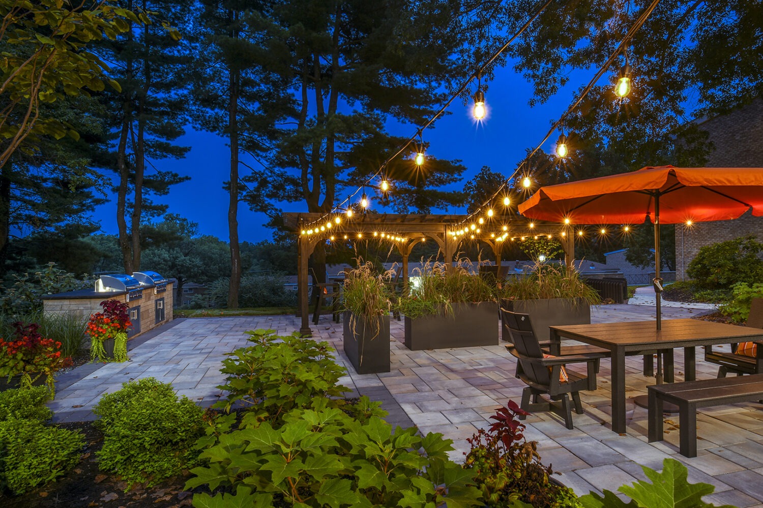 Outdoor Lounge Area at night with string lights