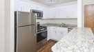 Kitchen with white cabinets and breakfast bar