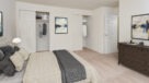 bedroom with carpeting and large closet