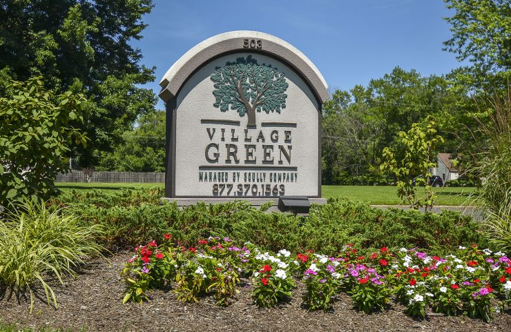 signage with flowers around 