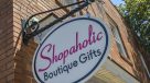 signage of Shopaholic Boutique located on main street 