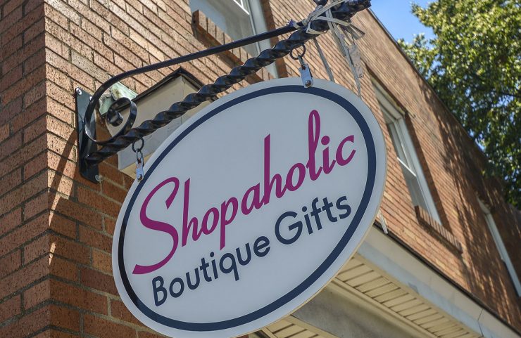signage of Shopaholic Boutique located on main street 