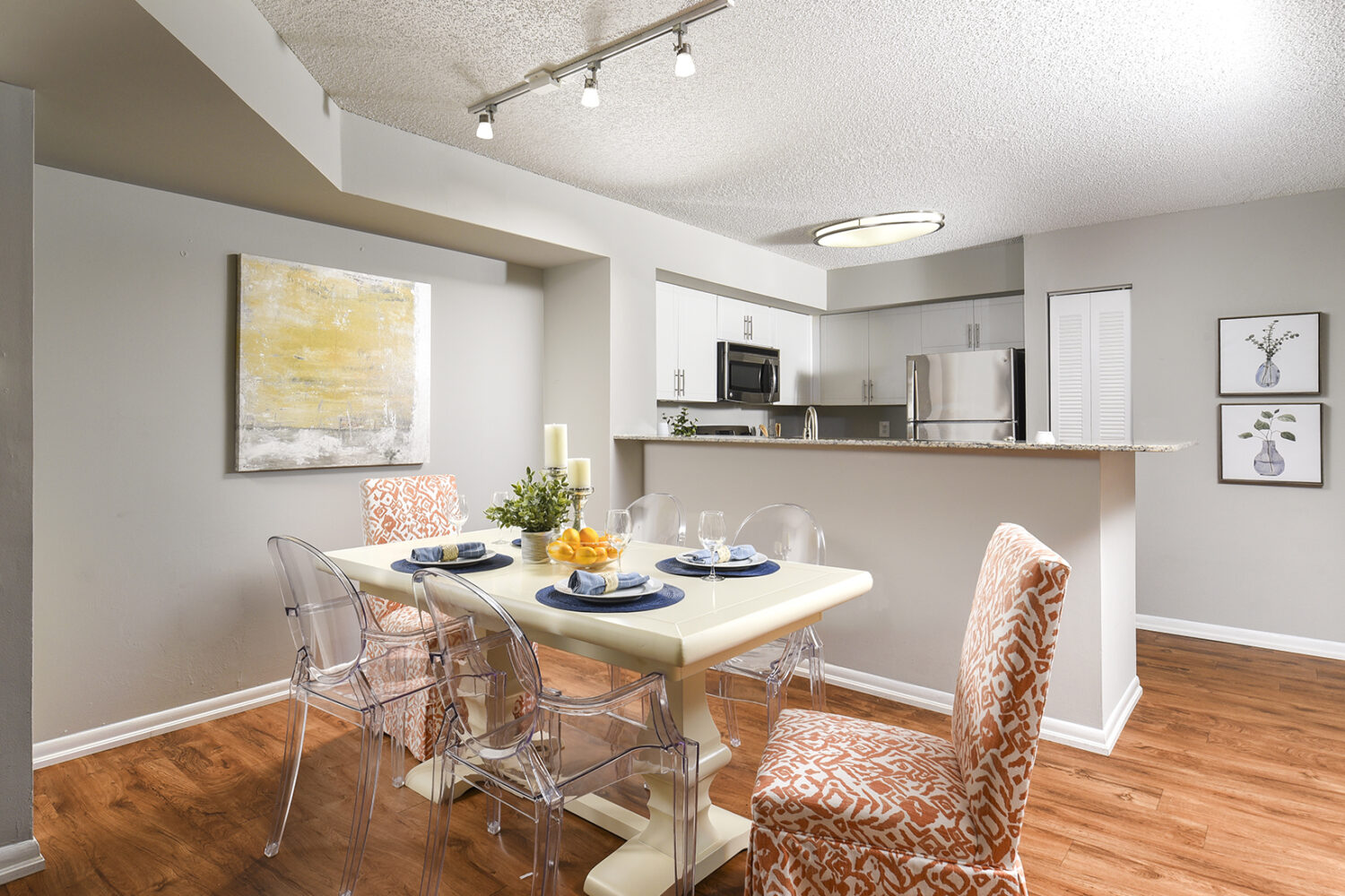 open kitchen into dining area with plank flooring 