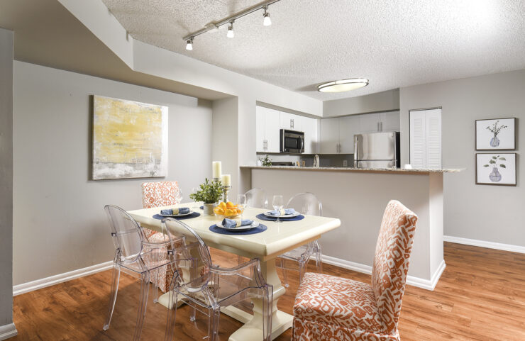open kitchen into dining area with plank flooring 