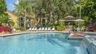 heated outdoor pool with small water fall 