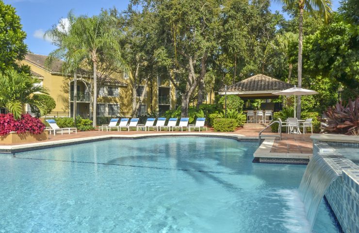heated outdoor pool with small water fall 