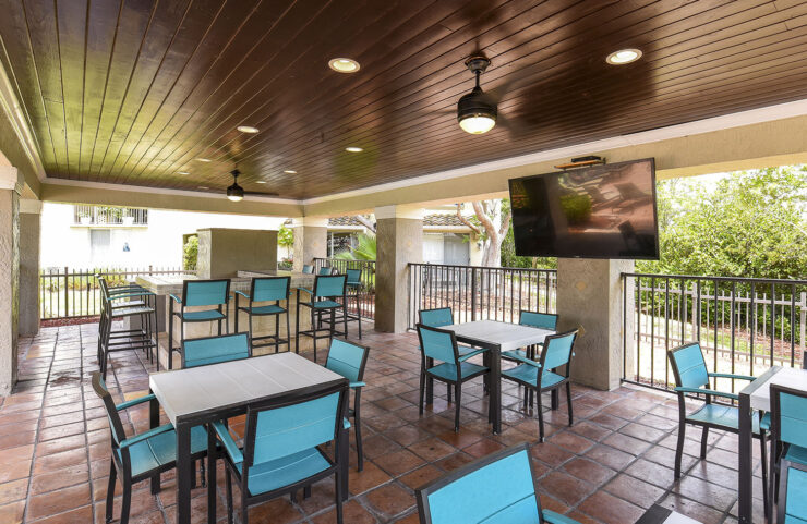 patio seating area with ceiling fans