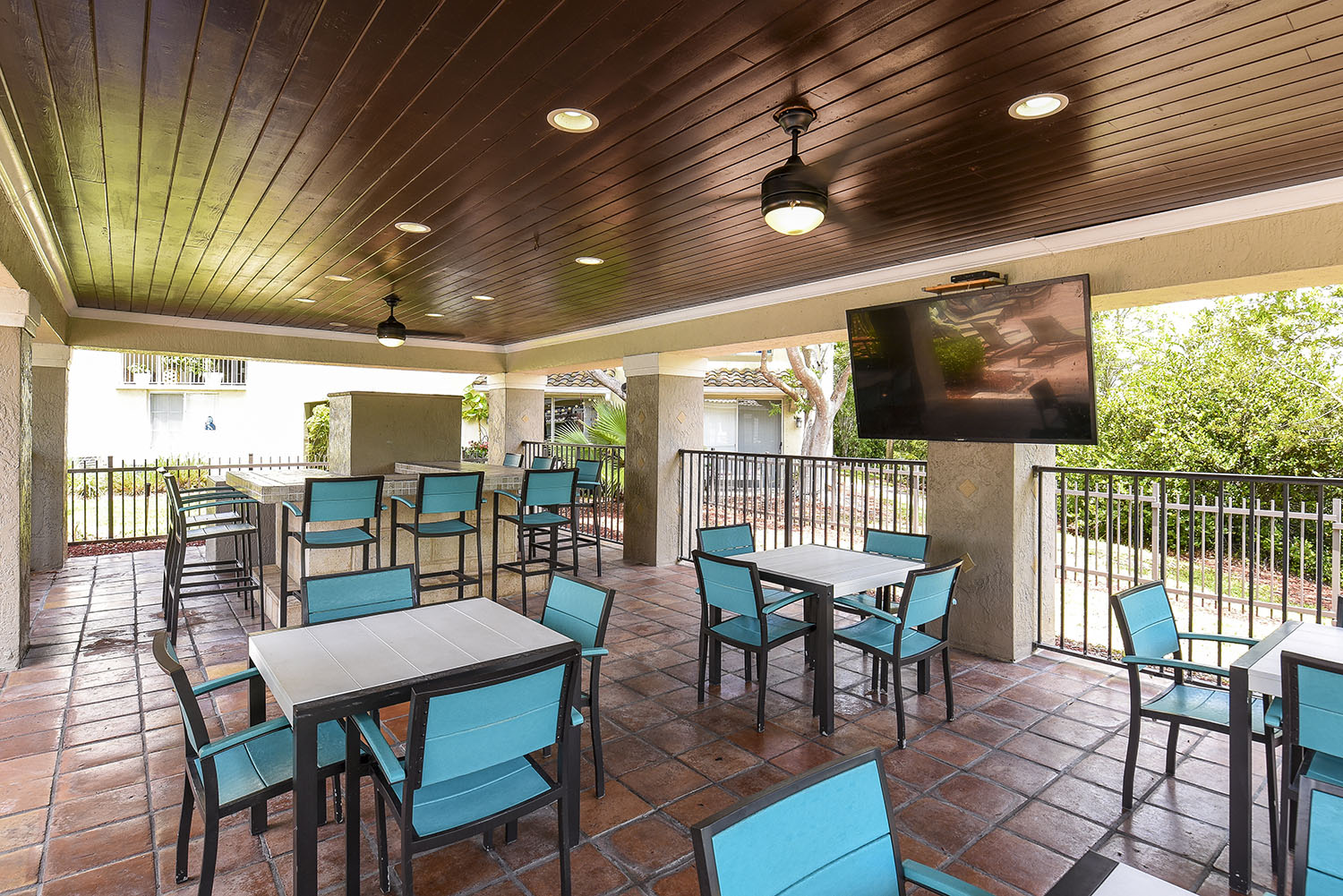 patio seating area with ceiling fans