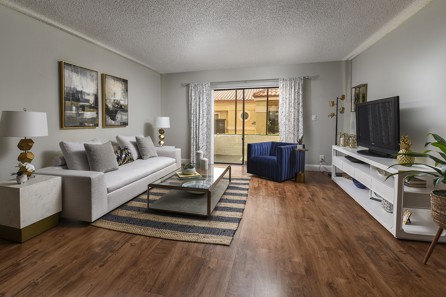 large living room with plank flooring and access to screened in patio