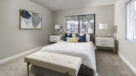 large bedroom with wall to wall carpet