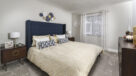 large bedroom with wall to wall carpet in boca raton