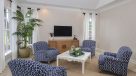 comfy seating area in clubhouse with tv 