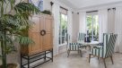 clubhouse table and chairs by large windows 
