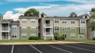 exterier of buiding with balconies and parking 