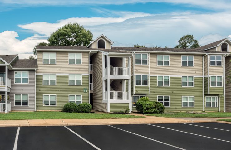 exterier of buiding with balconies and parking 