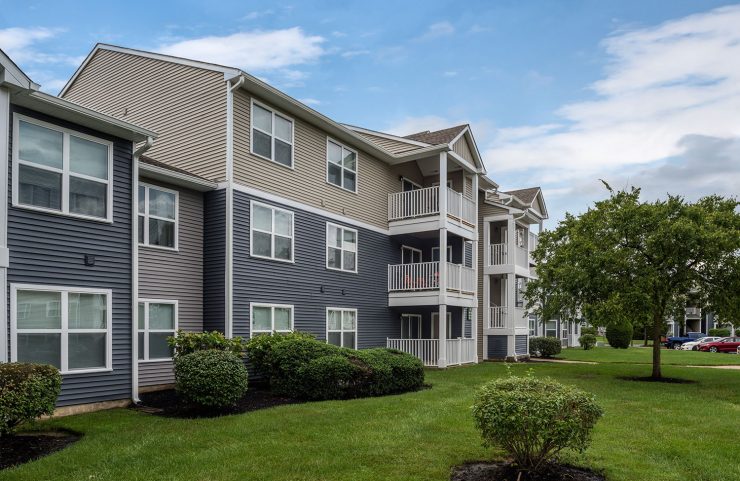exterior with landscaped bushes 