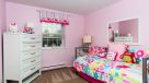 secondary bedroom with wall to wall carpet