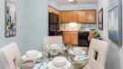 dining and kitchen area with oak cabinets 