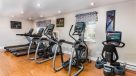 treadmills, ellipticals and bikes in fitness center 