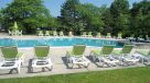 salt water pool with plenty of lounge chairs 
