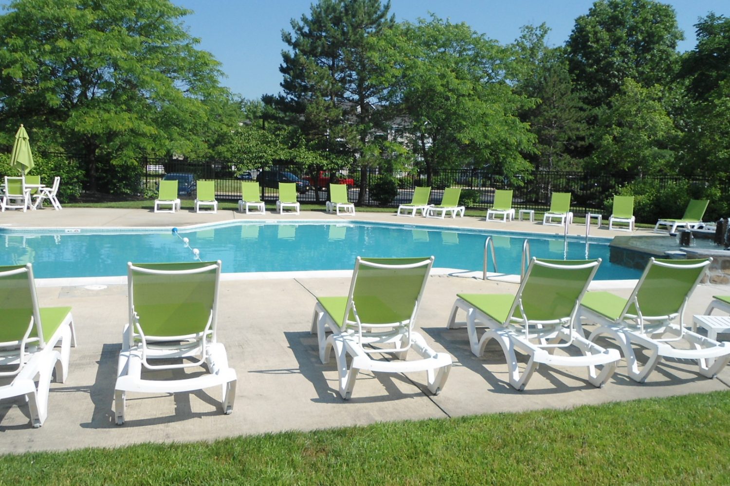 salt water pool with plenty of lounge chairs 