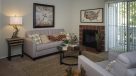 living room with fireplace and sliding doors to a private patio