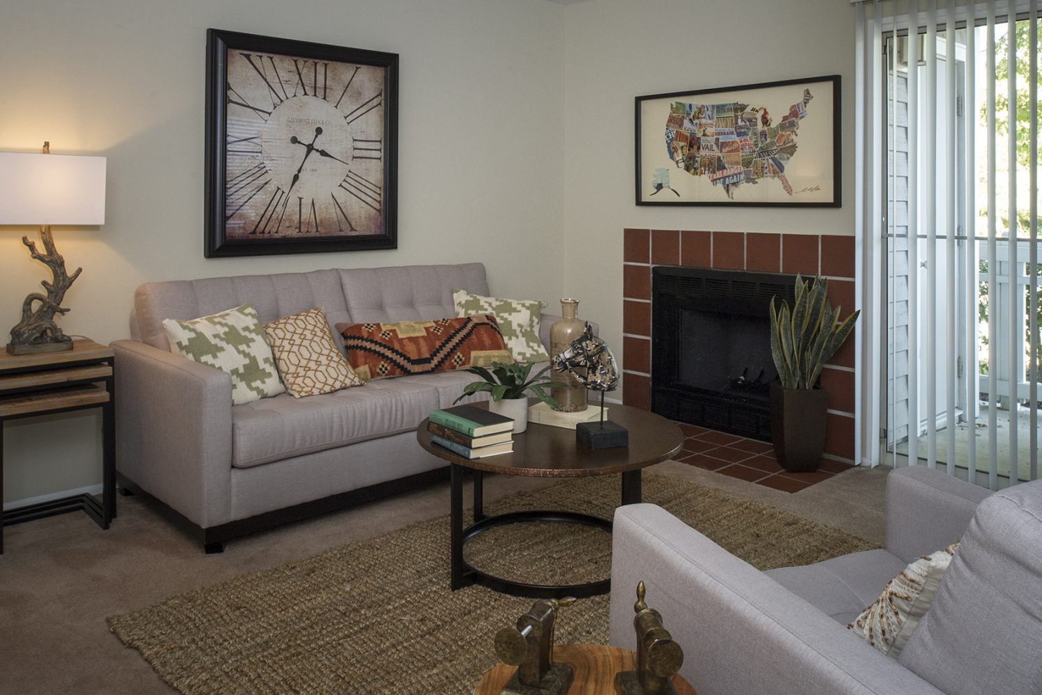 living room with fireplace and sliding doors to a private patio