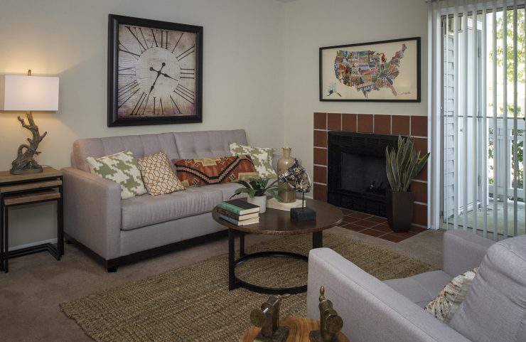 living room with fireplace and sliding doors to a private patio