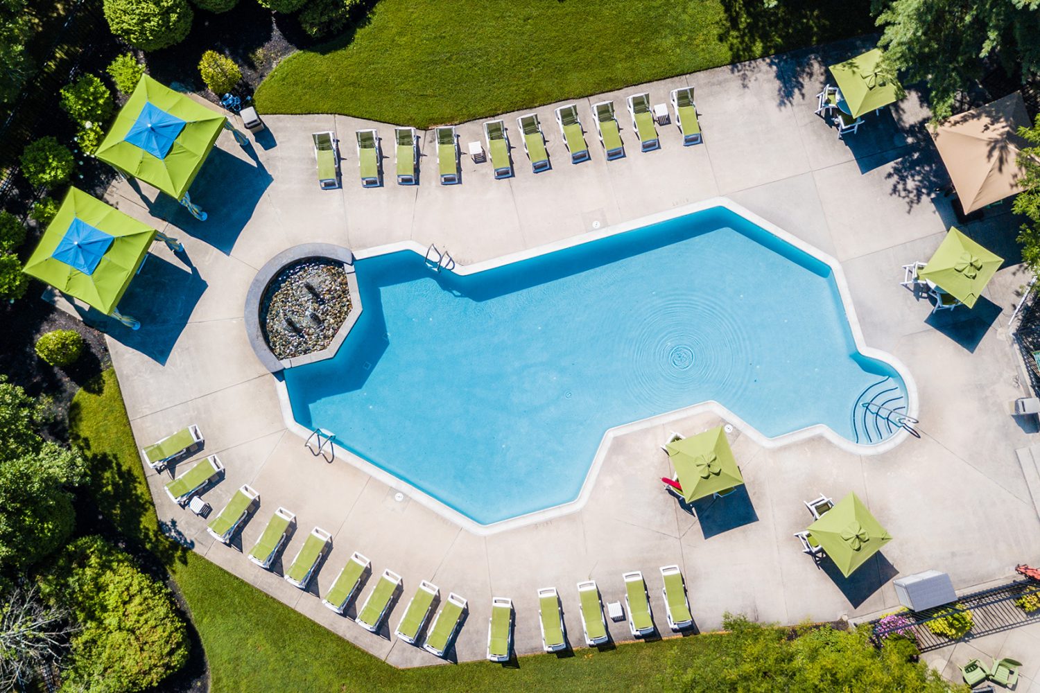 aerial view of outdoor salt water pool and cabanas