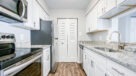 modern kitchen with white cabinets