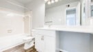 updated bathroom with white vanity
