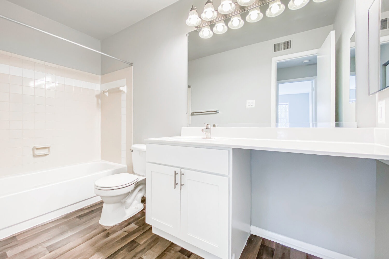 updated bathroom with white vanity