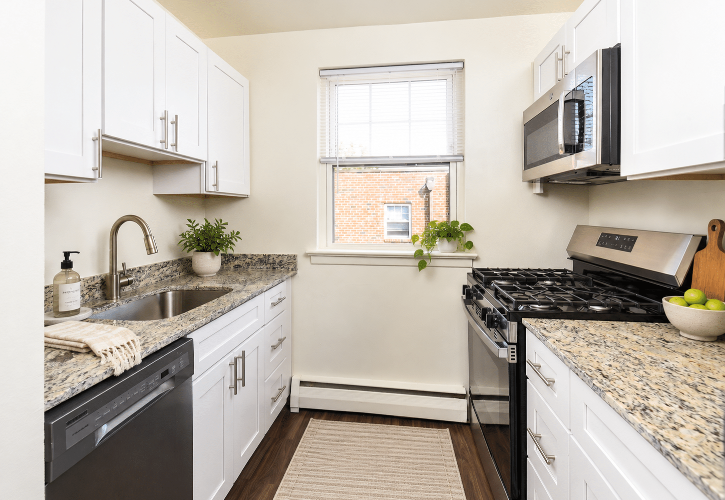 galley style kitchen with large window 