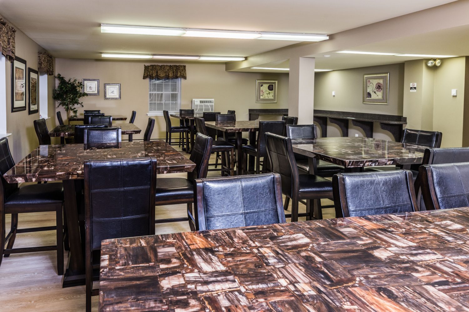 tables and chairs in the community center 