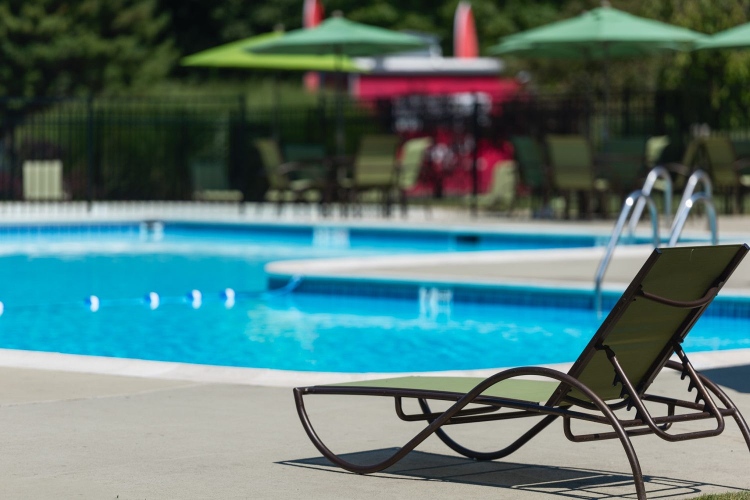 lounge chair facing pool 