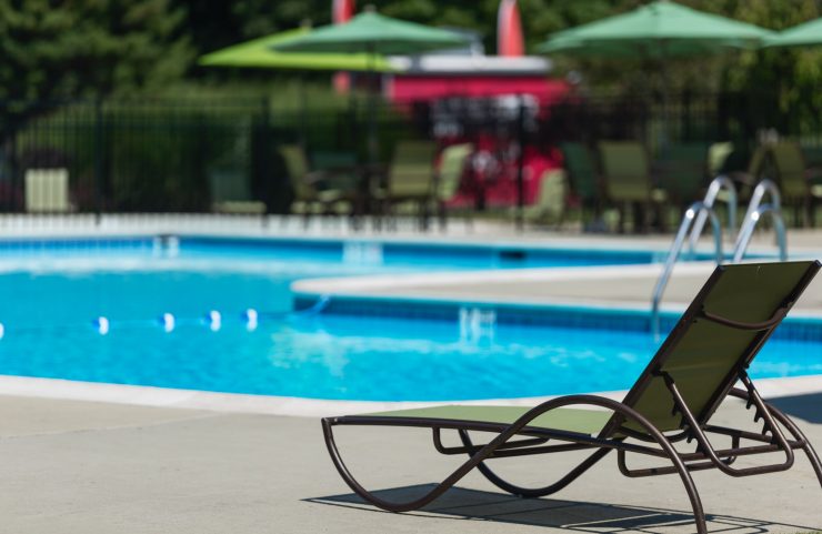 lounge chair facing pool 
