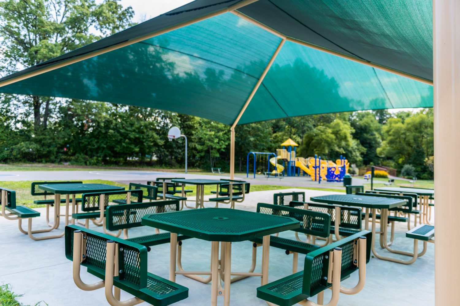 covered picnic area with benches and tables