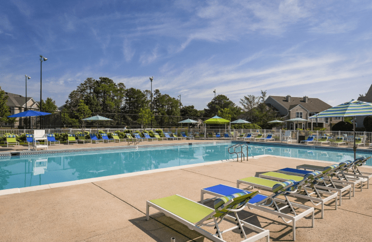 large outdoor pool with plenty of seating